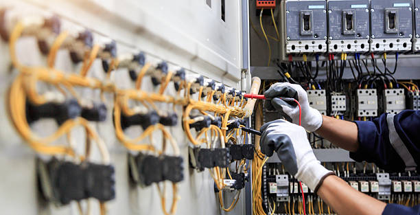 Professional Electrician technician working in Kent Acres, DE